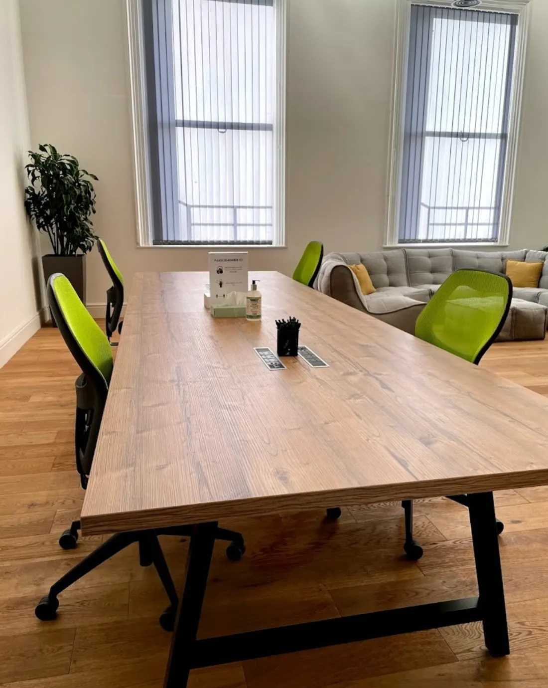 A meeting room at the AllCampus UK office in Derby, with a large table and natural light.